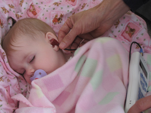 a baby getting a hearing screening